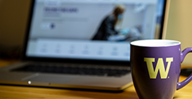 Computer and coffee mug on desk