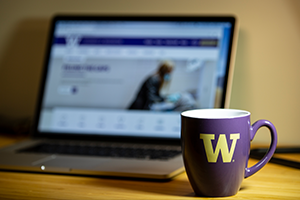 Computer and coffee mug on desk